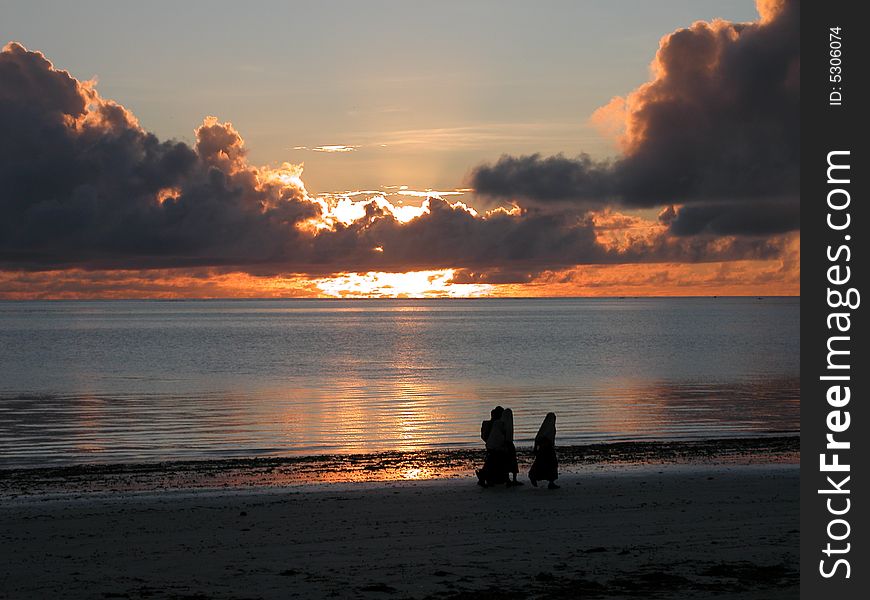 Childrens going to school in a Zanzibar sunrise. Childrens going to school in a Zanzibar sunrise