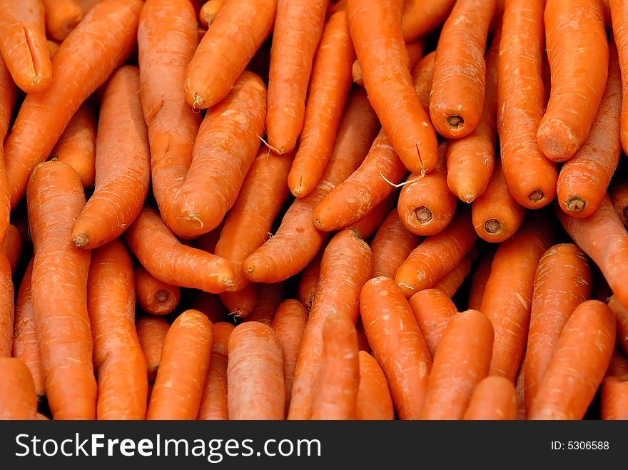 Pile of fresh carrots at for display at market