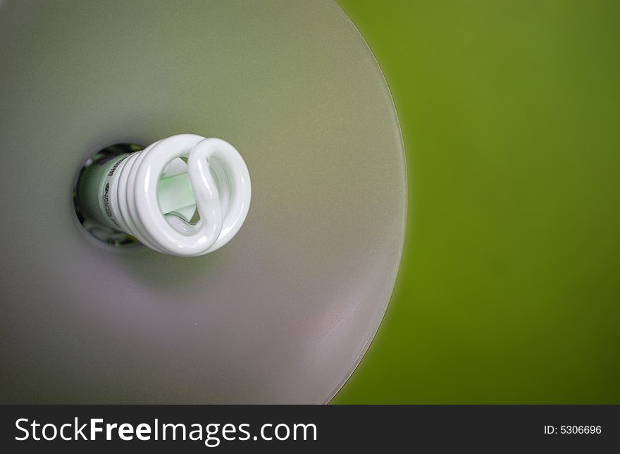 Go green with energy saving light bulbs! Picture shows inside of a lamp with a green wall/backdrop behind it. Go green with energy saving light bulbs! Picture shows inside of a lamp with a green wall/backdrop behind it.