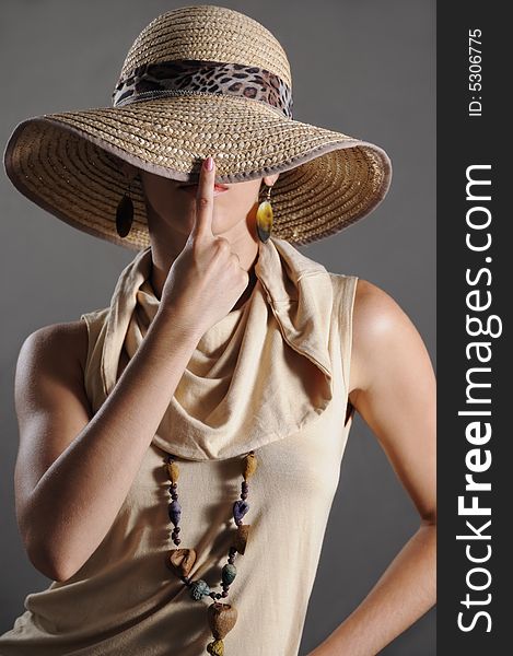 Portrait of stylish woman covering her face. Portrait of stylish woman covering her face