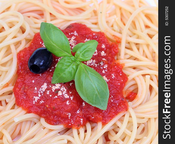 Pasta with tomato sauce basil olive and grated parmesan. Pasta with tomato sauce basil olive and grated parmesan