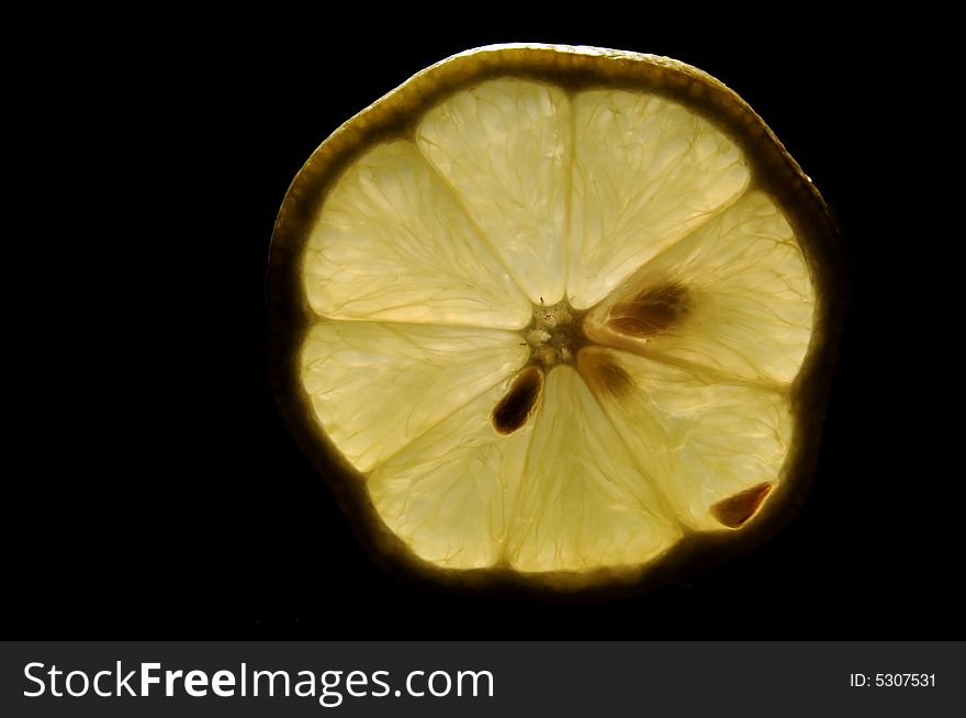 Backlit lemon on isolated background