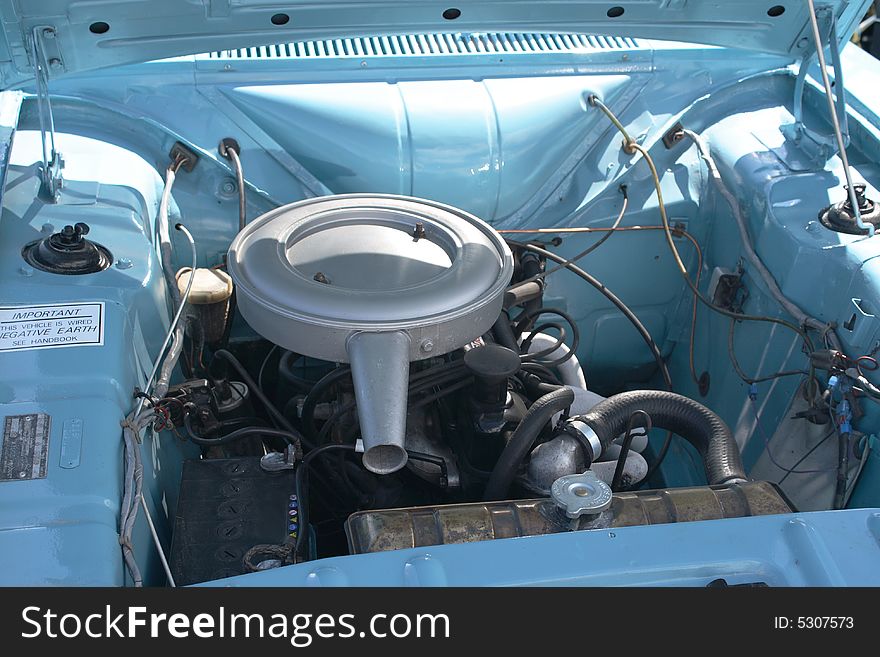 The view of a perfectly kept old vehicles engine bay. The view of a perfectly kept old vehicles engine bay