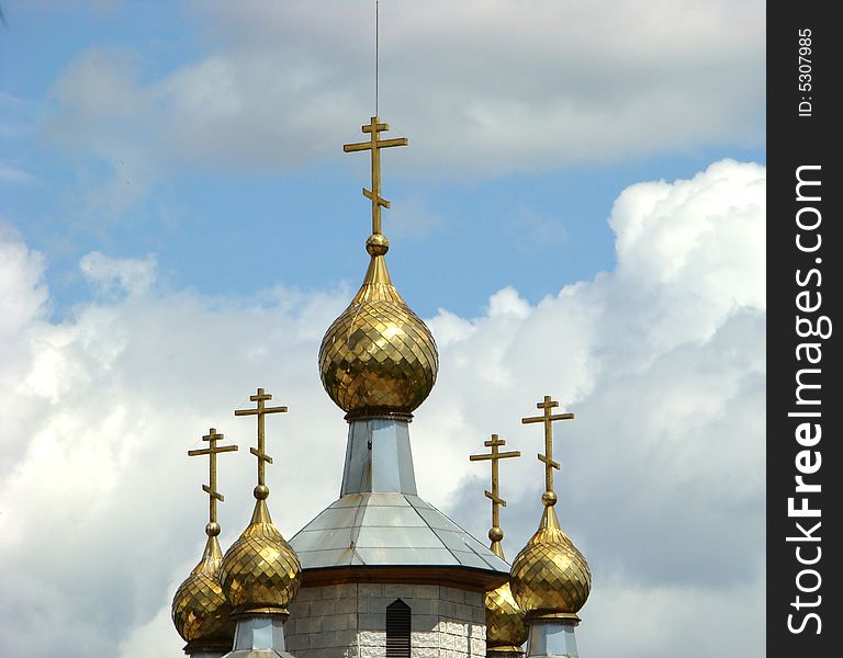 Gold domes of a temple of Andrey Pervozvannogo in Ljublino in Moscow