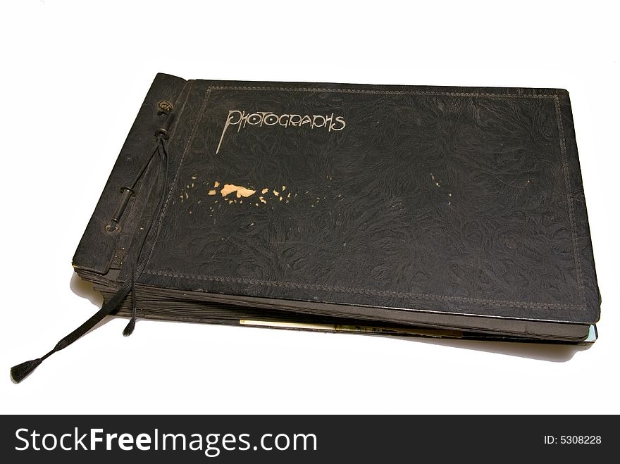 A very old family photo album, worn and used. A very old family photo album, worn and used.