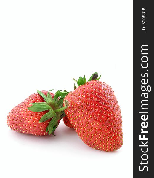Juicy strawberries isolated over white background, concept of healthy organic, homegrown food and diet.