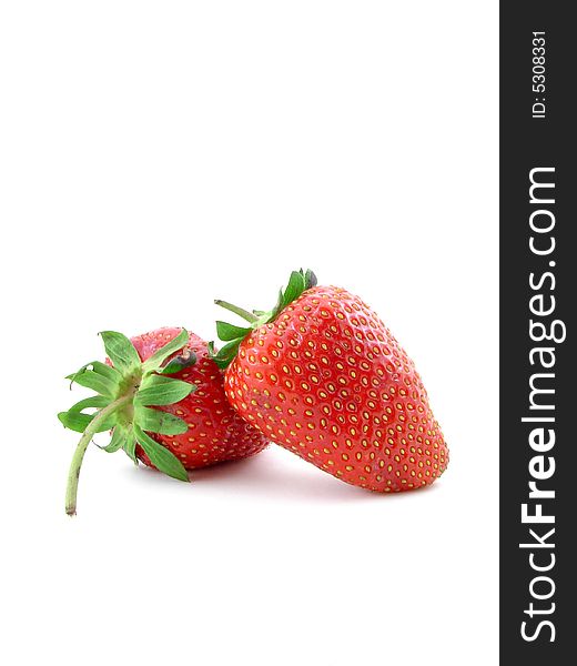 Juicy strawberries isolated over white background, concept of healthy organic, homegrown food and diet.