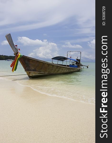 Longtail boat in bright blue water, Koh Poda, Krabi Province, Thailand