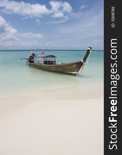 Longtail boat in bright blue water, Koh Poda, Krabi Province, Thailand