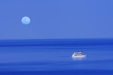 Moon Over Blue Lake With Boat Royalty Free Stock Image