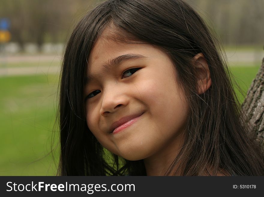 Close up of girl with cute smile. Part asian, scandinavian
