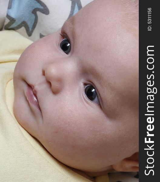 Close-up shot of a four month old baby girl's face. Close-up shot of a four month old baby girl's face.