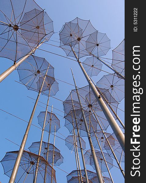 View on umbrellas against a blue sky