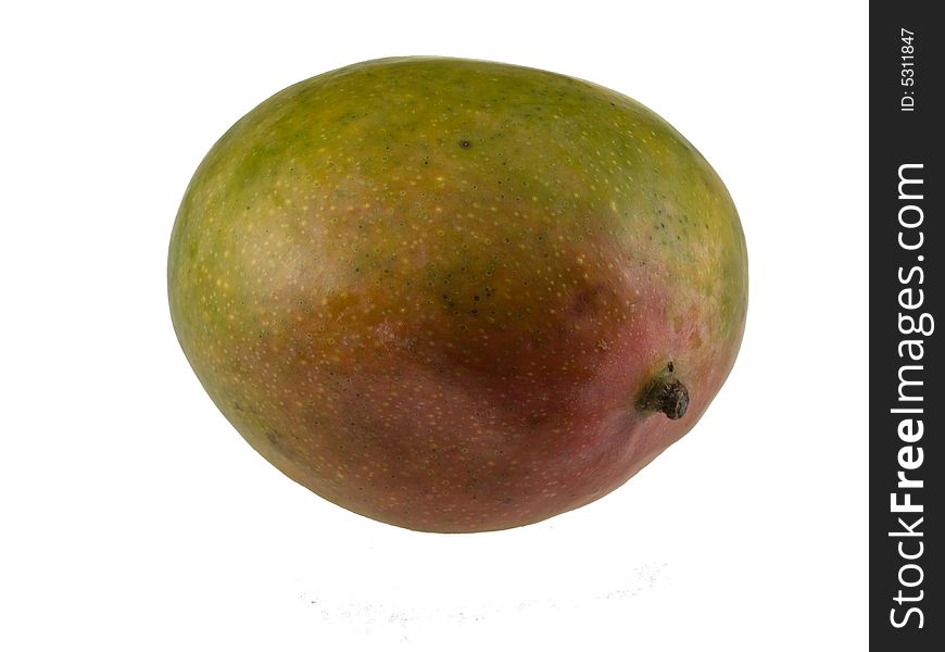 Juicy whole mango isolated against white background