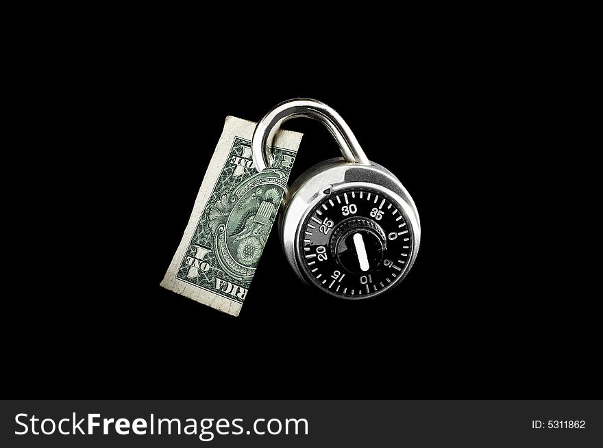 Dollar bill locked up with combination lock.
