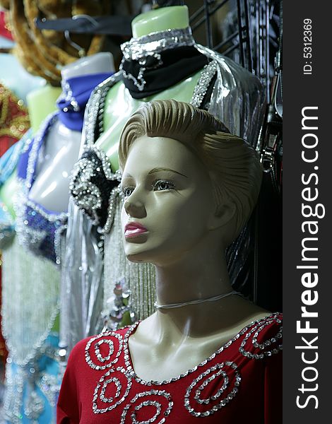 Female dummy in a show-window of shop of clothes