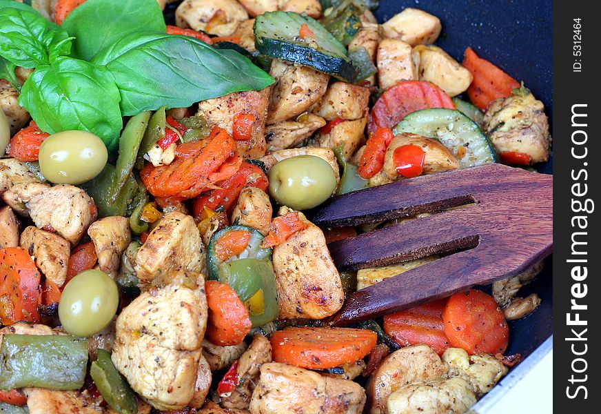 Cooking vegetables and meat in a pan