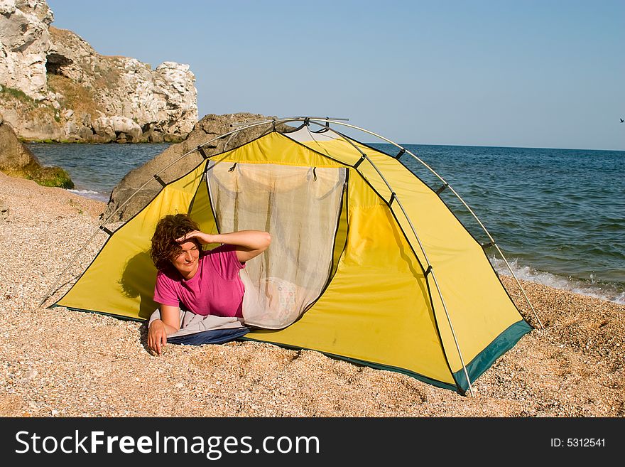 Girl looking out from the tent