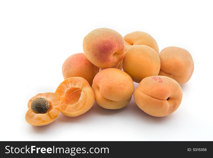 Group of apricots with on open isolated on white