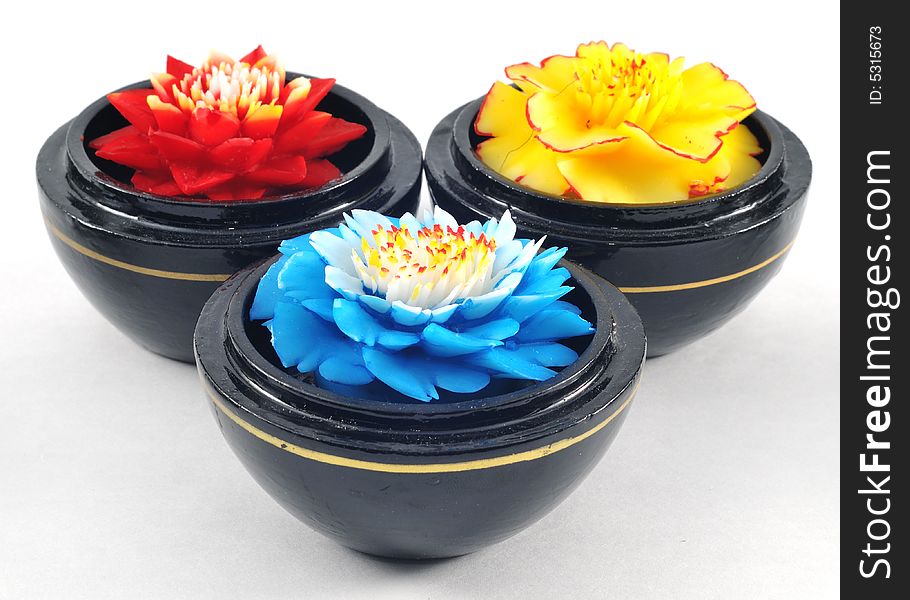 Flower soap carvings in vibrant primary colours. Flower soap carvings in vibrant primary colours