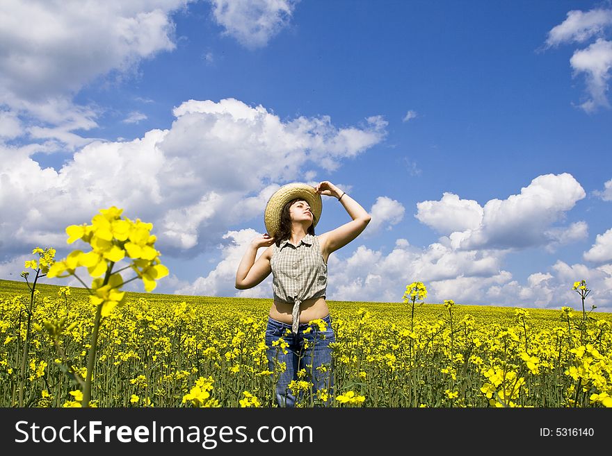 Girl having fun in summer rape field. Girl having fun in summer rape field