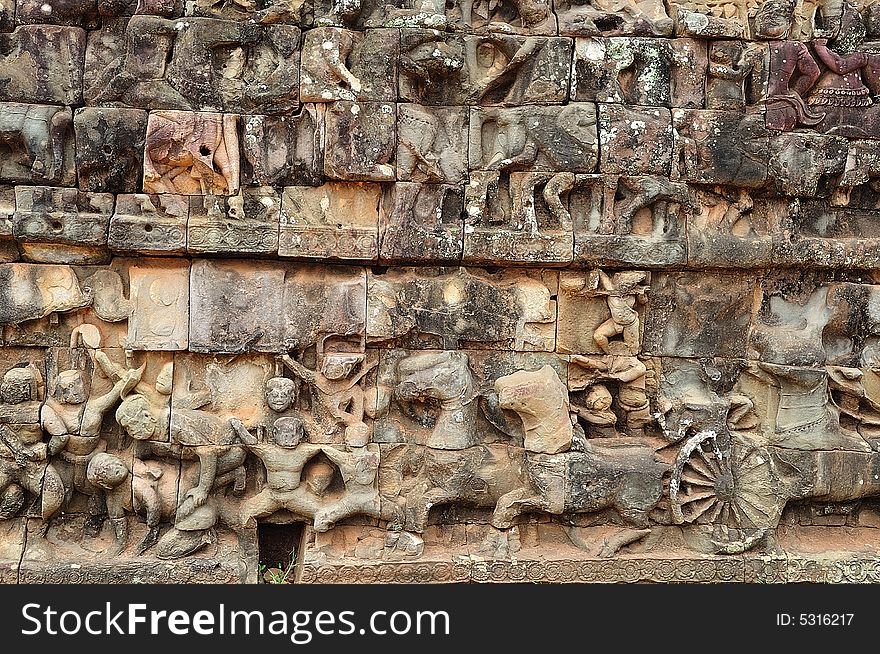 The leper king terrace constructed during the reigns of Jayavarman VII and Jayavarman VIII (12th-13th centuries) overlooking the royal square is supported by 300 meters of walls of foundation; these walls are carved with mythological figures. The leper king terrace constructed during the reigns of Jayavarman VII and Jayavarman VIII (12th-13th centuries) overlooking the royal square is supported by 300 meters of walls of foundation; these walls are carved with mythological figures