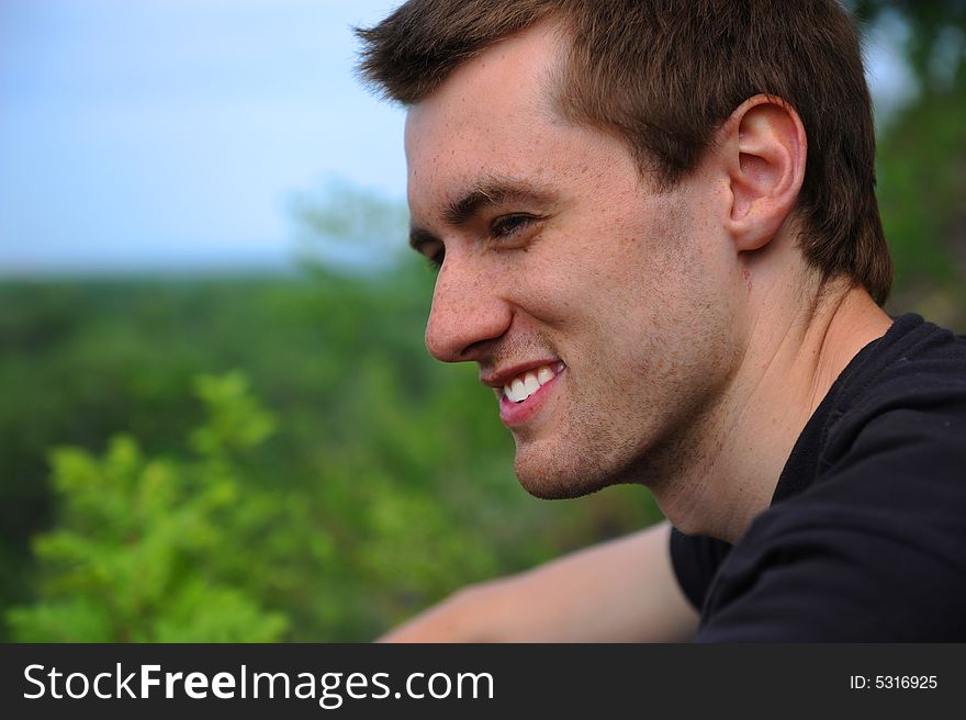 Close-up. Portrait of the beautiful young man of the outdoors