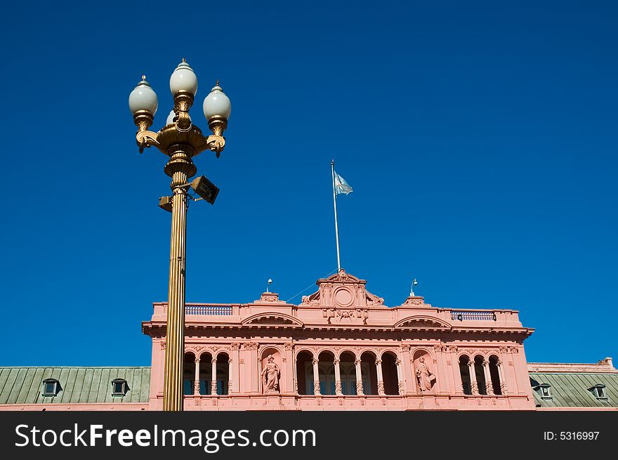 Pink house, official house of the president of Argentina, with a streetlight. Pink house, official house of the president of Argentina, with a streetlight