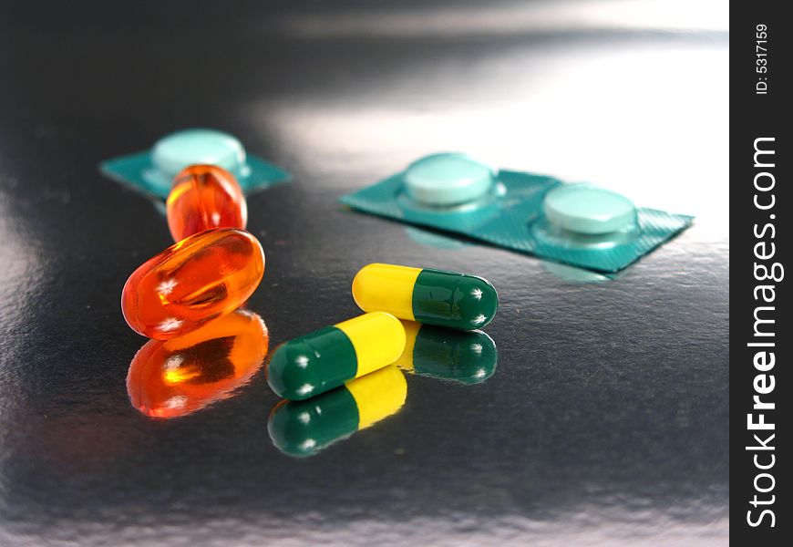 Many medicines in a silver background