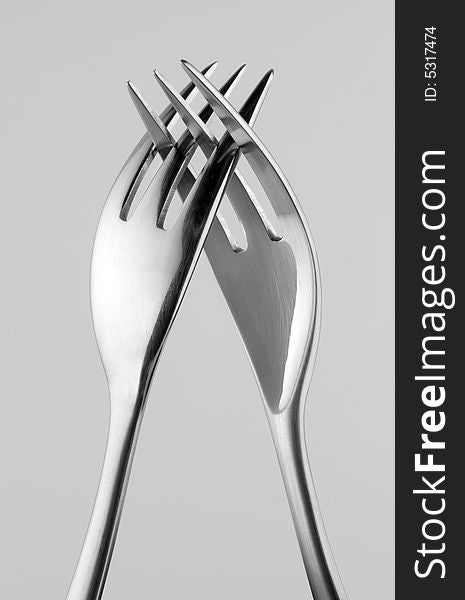 Two Forks Intertwined On Gray