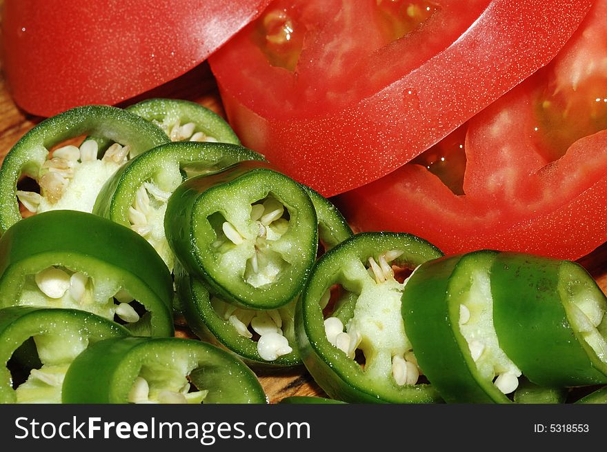 It is green peppers and red tomato. It is green peppers and red tomato.