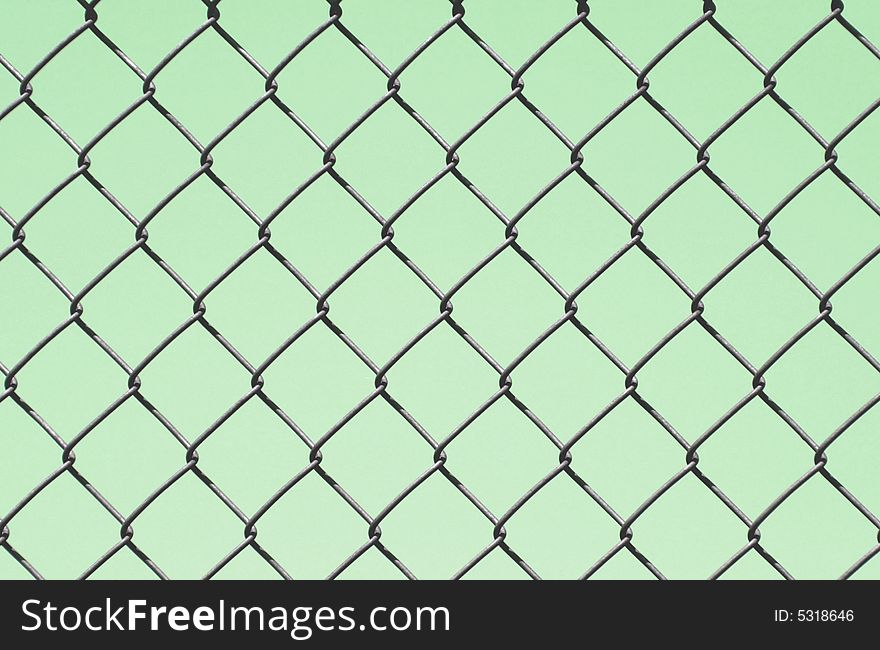 Chain link fence design on a green background. Chain link fence design on a green background