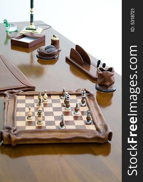 Chess on an office table and different accessories
