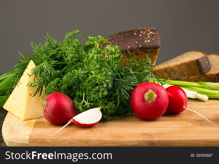 Healthy vegetarian food. Radishes, parsley, green onions