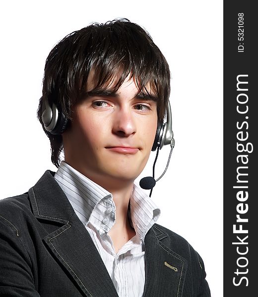 A portrait about a handsome helpdesk operator man who is smiling and he has a headphone. He is wearing a white shirt and a stylish black suit. A portrait about a handsome helpdesk operator man who is smiling and he has a headphone. He is wearing a white shirt and a stylish black suit.