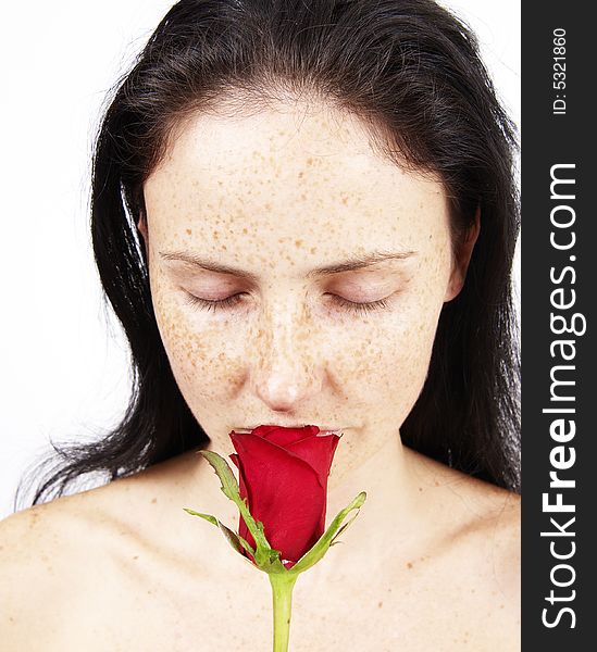 Beautiful brunette woman with a rose