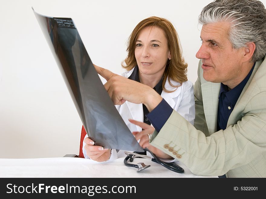Doctors discussing a radiography of a patient. Doctors discussing a radiography of a patient