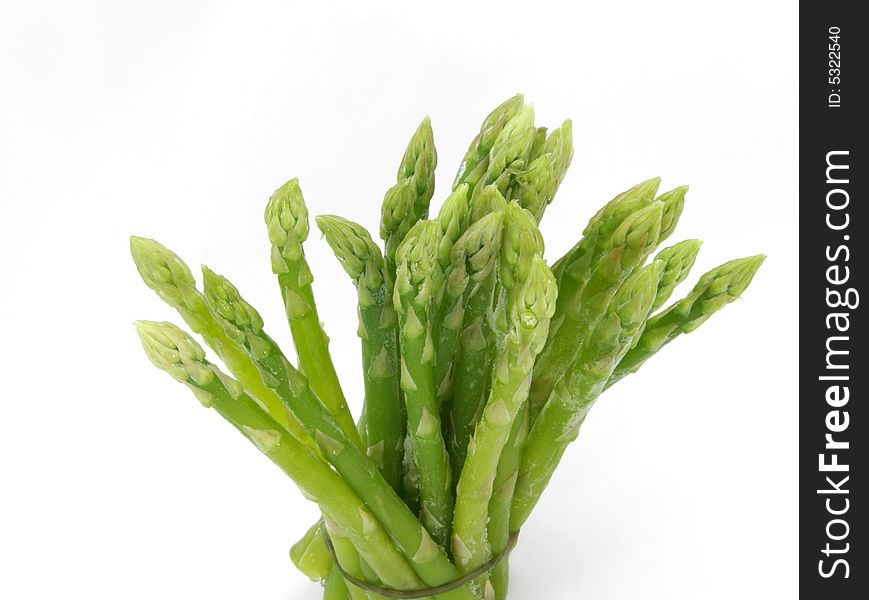 close up of frozen asparagus on white. close up of frozen asparagus on white
