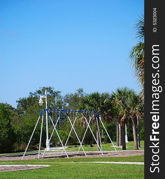 Photo of a swings out on a playground in Florida.