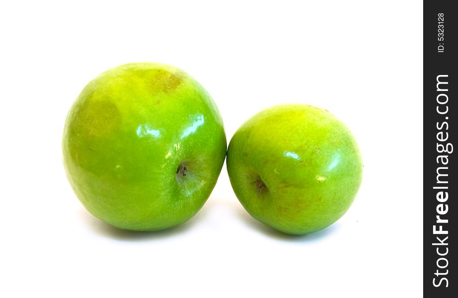 Two green apples on white background.