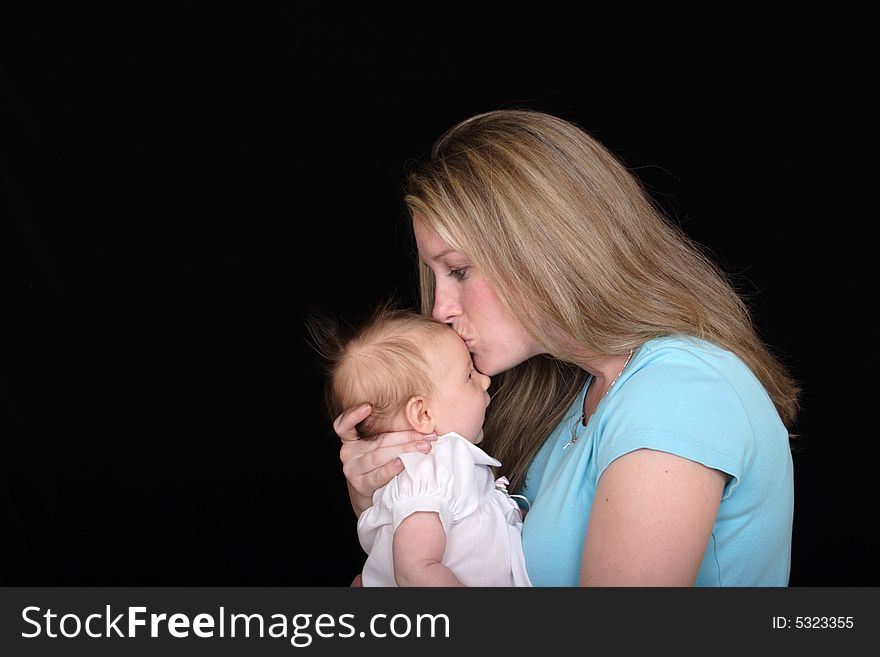 Mother Kissing Daughter