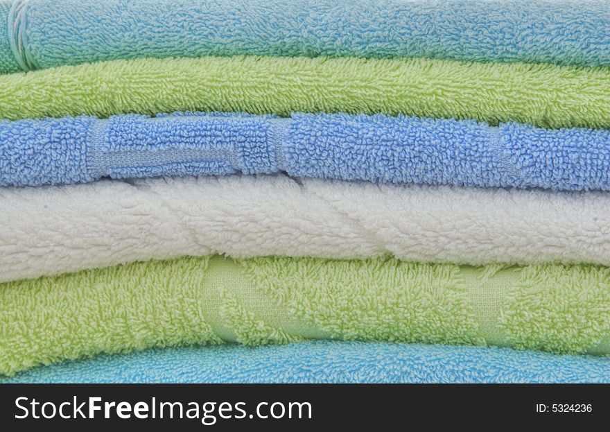 The combined multi-colored double towels as a background. The combined multi-colored double towels as a background