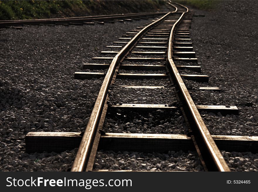Photo of rails leaving in a distance