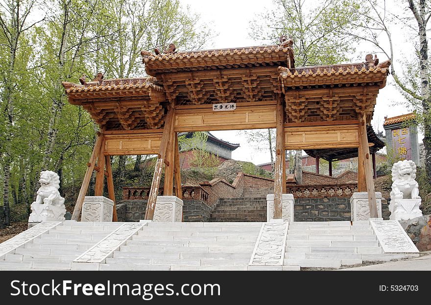 Temple gate while repairing.
Chinese on the temple gate is Buddha's glory.

Chinese characters are seven temple(Buddhist)s on the stone tablet on the right. Temple gate while repairing.
Chinese on the temple gate is Buddha's glory.

Chinese characters are seven temple(Buddhist)s on the stone tablet on the right.