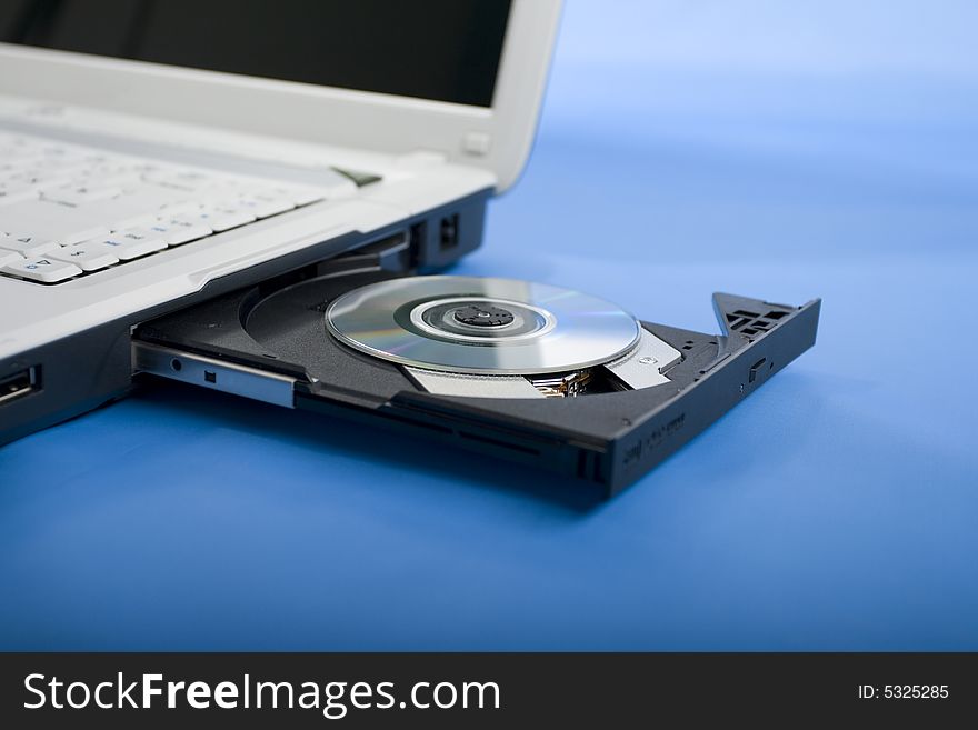 Computer and disk drive, black and white color, dvd-rom. Computer and disk drive, black and white color, dvd-rom.