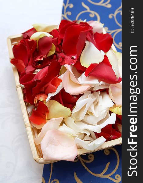 Wedding basket. Petals roses in basket cloth