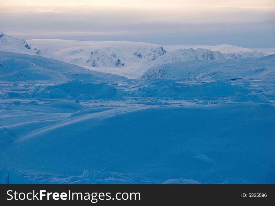 Sunset on Sermilik fjord's ice field in Greenland