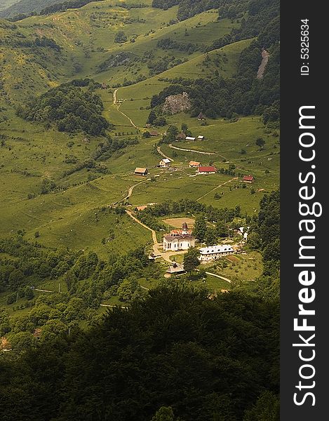 A view from above of a monastery in Romania, Trascau mountains. A view from above of a monastery in Romania, Trascau mountains