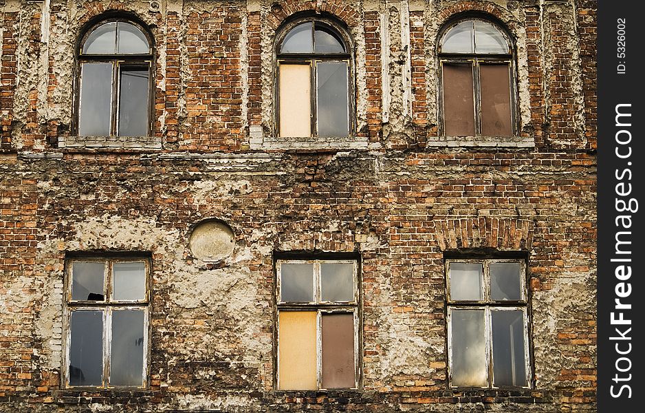 Six windows in an old red brick brown stone building before demolition endings and beginnings. Six windows in an old red brick brown stone building before demolition endings and beginnings