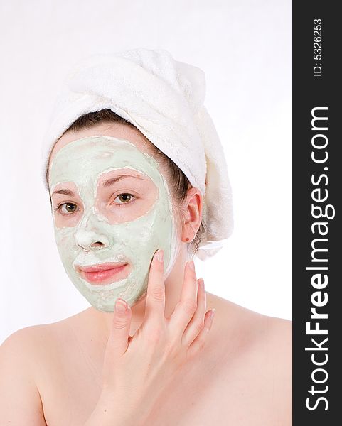 Woman with green mask on her face healthy treatment. Woman with green mask on her face healthy treatment